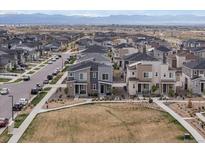 Expansive aerial view of a modern housing community with mountain views at 24333 E 41St Ave, Aurora, CO 80019