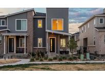 Charming two-story townhome with modern gray siding and brick accents at 24333 E 41St Ave, Aurora, CO 80019