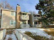 Attractive condo building with stone accents, balconies, and well-maintained landscaping at 14172 E Colorado Dr # 204, Aurora, CO 80012