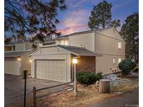 Inviting townhouse featuring an attached garage and classic brick accents, perfect for comfortable living at 2748 S Kenton Ct, Aurora, CO 80014