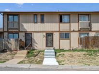 Charming townhome featuring a secure front door entry and inviting curb appeal at 2567 Rainbow Dr # 80, Denver, CO 80229