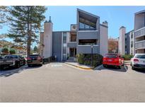 View of the apartment complex exterior showcasing its architecture and parking area at 6490 S Dayton St # L10, Englewood, CO 80111