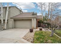 Charming home featuring a two-car garage, neutral exterior, and manicured landscaping at 758 Chimney Creek Dr # C, Golden, CO 80401