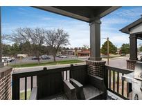 View of the balcony area showcasing outdoor seating furniture and a barbecue grill at 1312 Independence St # 3, Lakewood, CO 80215