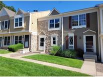 Charming townhome featuring stone accents, well-maintained landscaping, and inviting front entrances at 15507 E Louisiana Ave, Aurora, CO 80017