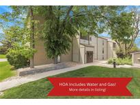 Charming condo complex with well-maintained lawns and mature shade trees offers a welcoming curb appeal at 7318 S Xenia Cir # B, Centennial, CO 80112