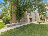 Attractive condo building with well-maintained landscaping and mature trees at 7318 S Xenia Cir # B, Centennial, CO 80112