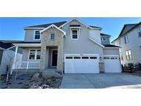 Beautiful two-story home with attached two-car garage and light gray siding at 3350 Backdrop Ct, Castle Rock, CO 80108