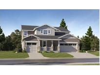 Charming two-story home with landscaped yard, two-car garage and covered porch at 1047 Morning Side Dr, Erie, CO 80516