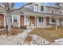 Inviting exterior of townhome with landscaping and walkway at 6712 E Briarwood Dr, Centennial, CO 80112