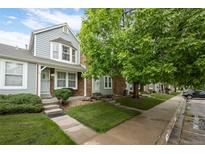 Charming townhomes with brick and siding, complemented by mature trees and well-maintained lawns at 4020 E 94Th Ave # B, Thornton, CO 80229