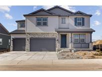 Charming two-story home featuring a three-car garage and covered porch, perfect for a growing Gathering at 3983 Breakcamp Ct, Castle Rock, CO 80108