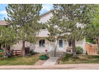 Inviting exterior view of a two-story home with a well-manicured lawn and mature trees at 4720 S Bannock St, Englewood, CO 80110