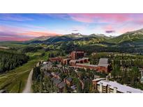 Aerial view of mountain resort community with homes and mountain backdrop at 555 S Park Ave # 202, Breckenridge, CO 80424
