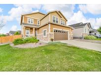 Charming two-story home with a well-manicured lawn and attached two car garage at 3762 White Rose Loop, Castle Rock, CO 80108