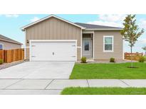 Charming single Gathering home featuring a manicured lawn and two car garage at 2214 Alyssa St, Fort Lupton, CO 80621