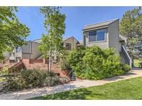 View of a multi-story townhouse complex featuring well-maintained landscaping and a private entrance at 3260 47Th St # 201A, Boulder, CO 80301