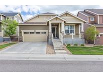 Charming single-Gathering home featuring a welcoming front porch and a well-maintained front yard at 22820 E Chenango Ave, Aurora, CO 80015