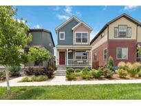 Charming two-story home with a cozy front porch and well-maintained landscaping at 12740 Tamarac St, Thornton, CO 80602
