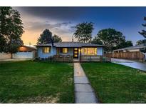 Modern ranch home with a newly landscaped front yard and updated facade at 4995 E Atlantic Pl, Denver, CO 80222