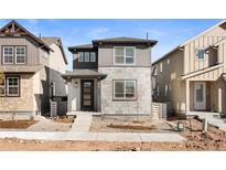 Charming two-story home featuring a modern facade and inviting front yard at 8777 Whiteclover St, Littleton, CO 80125