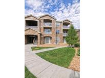 Inviting condo complex with well-maintained landscaping and private balconies at 7440 S Blackhawk St # 12-204, Englewood, CO 80112