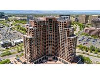 Stunning high-rise building featuring elegant brickwork and expansive windows showcasing panoramic city views at 8100 E Union Ave # 712, Denver, CO 80237