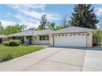 Charming single-story home features a well-maintained lawn, attached two-car garage, and welcoming curb appeal at 11328 W 27Th Ave, Lakewood, CO 80215