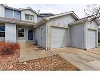 Charming home exterior with a one-car garage, stone landscaping, and a welcoming entrance at 11149 Gaylord St, Northglenn, CO 80233