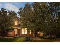 Inviting home with a manicured lawn and mature trees at 4069 S Abilene Cir # E, Aurora, CO 80014