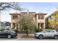 Charming two-story duplex with a classic facade and well-maintained landscaping at 1331 N Ogden St # 1, Denver, CO 80218