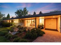 Charming single-story home with manicured landscaping and inviting entryway at 3925 S Cherry St, Englewood, CO 80113