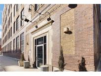 Brick building exterior with large windows and a prominent entrance at 1863 Wazee St # 6E, Denver, CO 80202