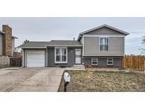Charming exterior of home showing nice yard and a cozy residential street at 2723 E 96Th Way, Thornton, CO 80229