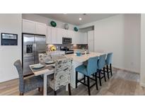 Modern kitchen with stainless steel appliances and an island at 9287 Twenty Mile Rd # 401, Parker, CO 80134