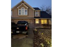 Charming two-story home with brick and siding, a two-car garage, and inviting curb appeal at 3839 E 135Th Way, Thornton, CO 80241