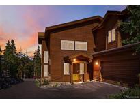 Charming exterior showcasing wood siding, a covered entry, and attached garage, perfect for mountain living at 180 Emmett Lode Rd, Breckenridge, CO 80424