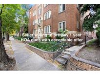 Charming brick apartment building featuring classic architecture, and well-maintained landscaping at 1050 N Washington St # 302, Denver, CO 80203