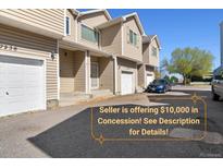 A townhouse complex featuring well-maintained exteriors, private garages and front entries at 7234 E 38Th Ave, Denver, CO 80207