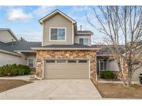 Charming two-story home with stone accents and a two-car garage at 5395 Canyon View Dr, Castle Rock, CO 80104