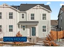 Charming two-story home featuring a light color scheme and a welcoming front entrance, perfect for a cozy Gathering living at 255 Mayfly Ln, Berthoud, CO 80513