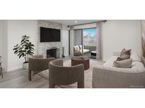 Bright living room with fireplace, balcony, neutral tones and city view at 800 N Pearl St # 611, Denver, CO 80203