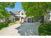 Beautiful two-story home with a well-maintained front yard and a spacious driveway leading to the garage at 7081 Salvia St, Arvada, CO 80007