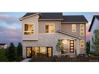 Inviting home showcasing a modern design, multiple windows, and well-maintained landscaping at 5726 Margarita Pt, Parker, CO 80134