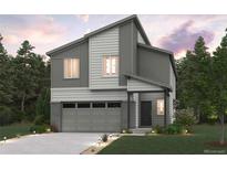 Striking two-story home with attached two car garage, modern design, and manicured landscaping at 19069 E 94Th Pl, Commerce City, CO 80022