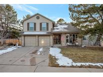 Charming two-story home featuring a two-car garage and inviting front porch at 170 Dover Ct, Castle Pines, CO 80108