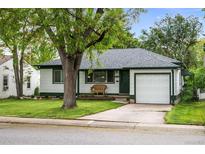 Charming single-story home with well-maintained lawn, attached garage, and mature shade tree at 3231 S Elati St, Englewood, CO 80110