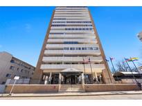 View of the Embassy House high rise with balconies on each floor against a blue sky at 1250 N Humboldt St # 202, Denver, CO 80218