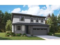 Charming two-story home with a modern design and beautiful landscaping, offering great curb appeal at 2681 Sawyer Ln, Erie, CO 80026
