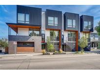Modern three-unit townhome development with sleek design and private entrances at 903 E 13Th Ave, Denver, CO 80218